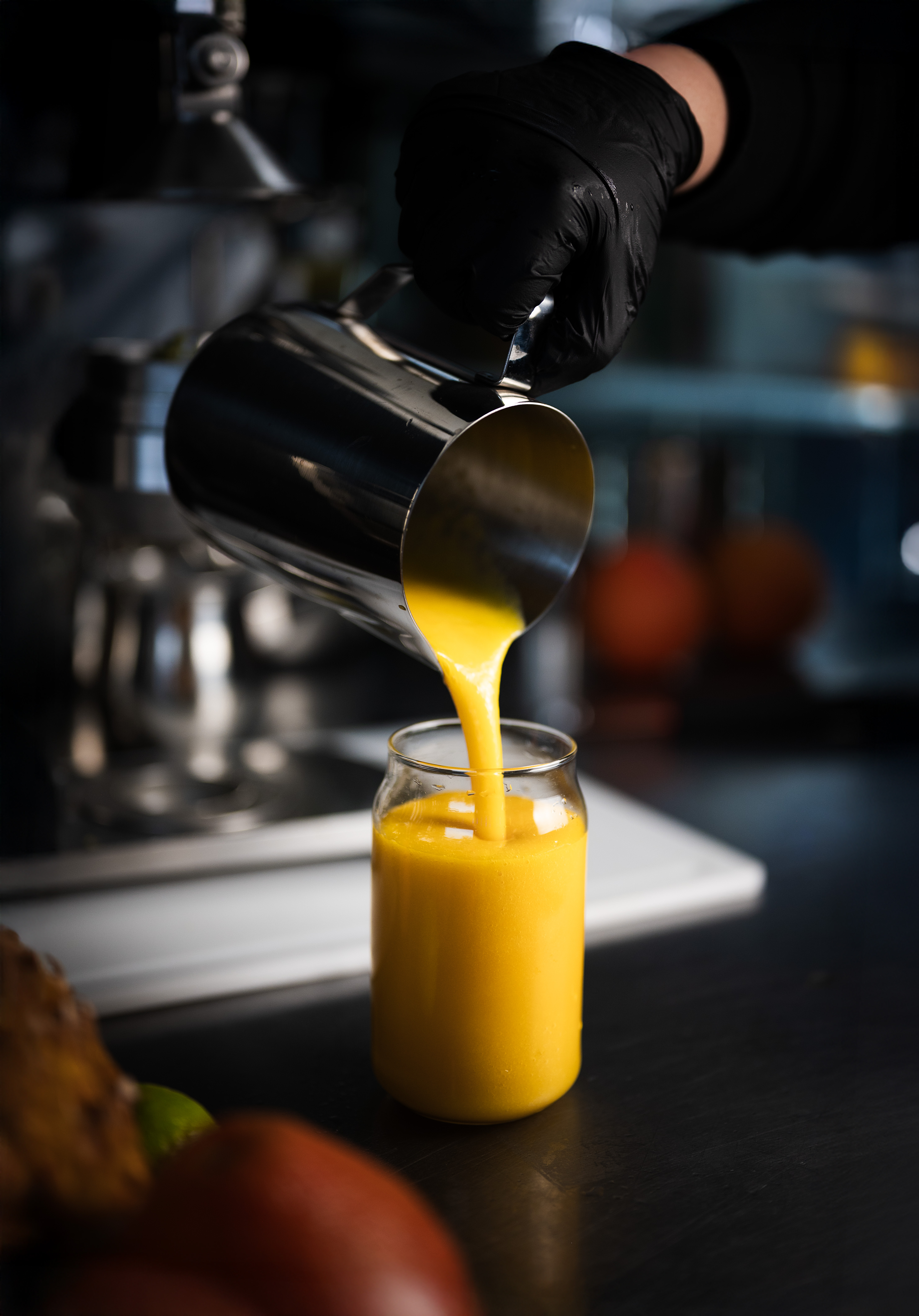 Fresh smoothie being poured into a glass
