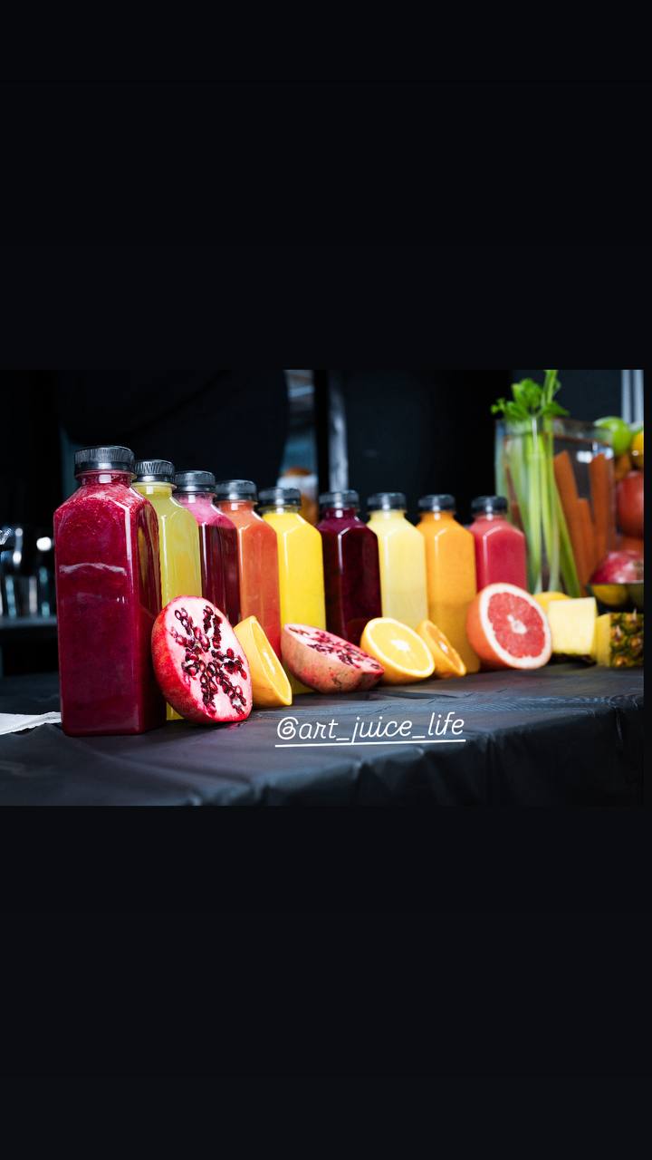 Lineup of fresh cold-pressed juices with seasonal fruit